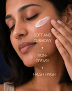 Close-up of woman applying day cream to her face for hydration, glow, and healthy-looking skin.